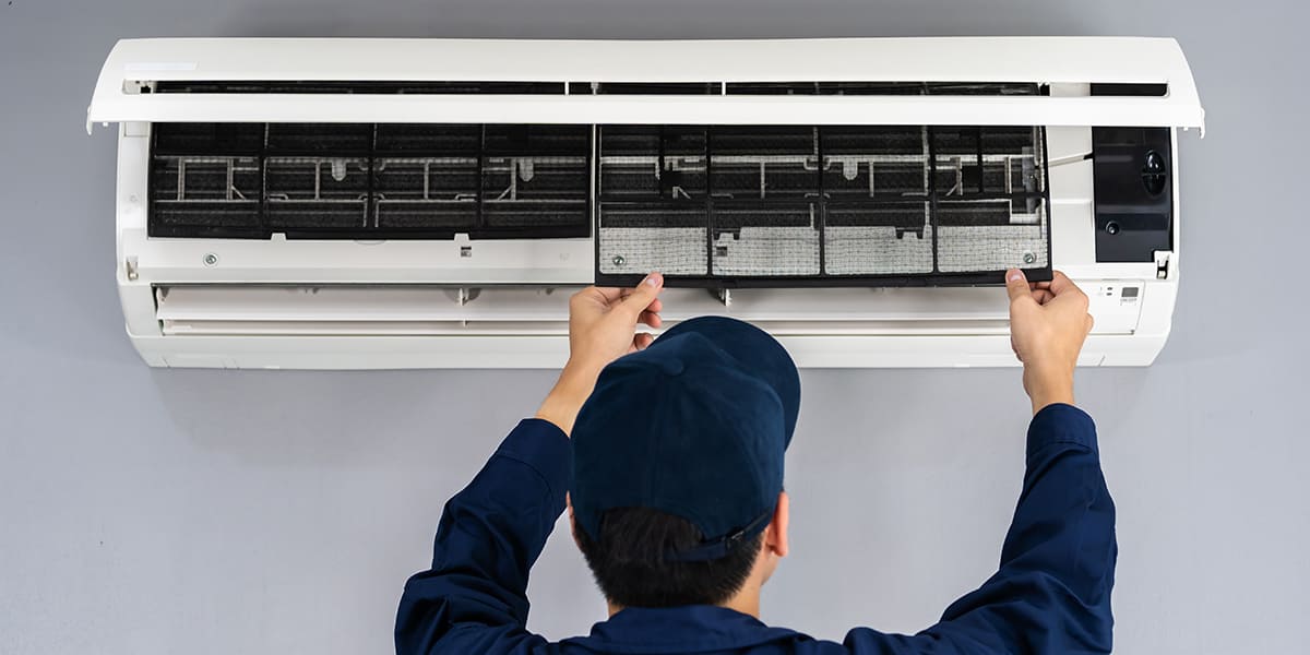 Professional Technician Repairing Air Conditioner Service in Chennai - Home Appliance Care
